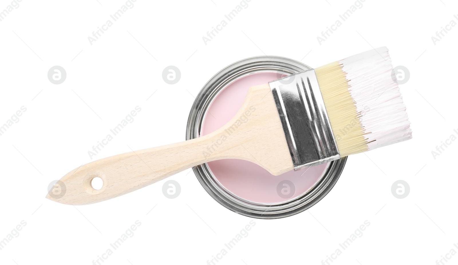 Photo of Can of pink paint with brush isolated on white, top view