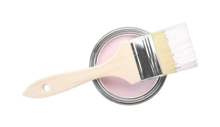 Photo of Can of pink paint with brush isolated on white, top view