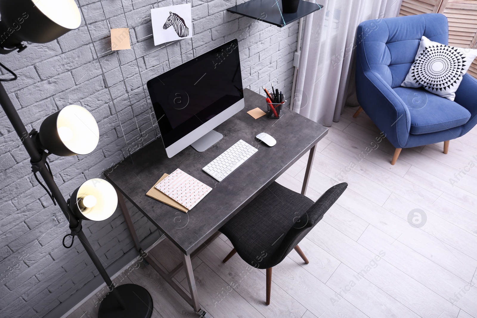 Photo of Comfortable workplace with computer on desk in home office