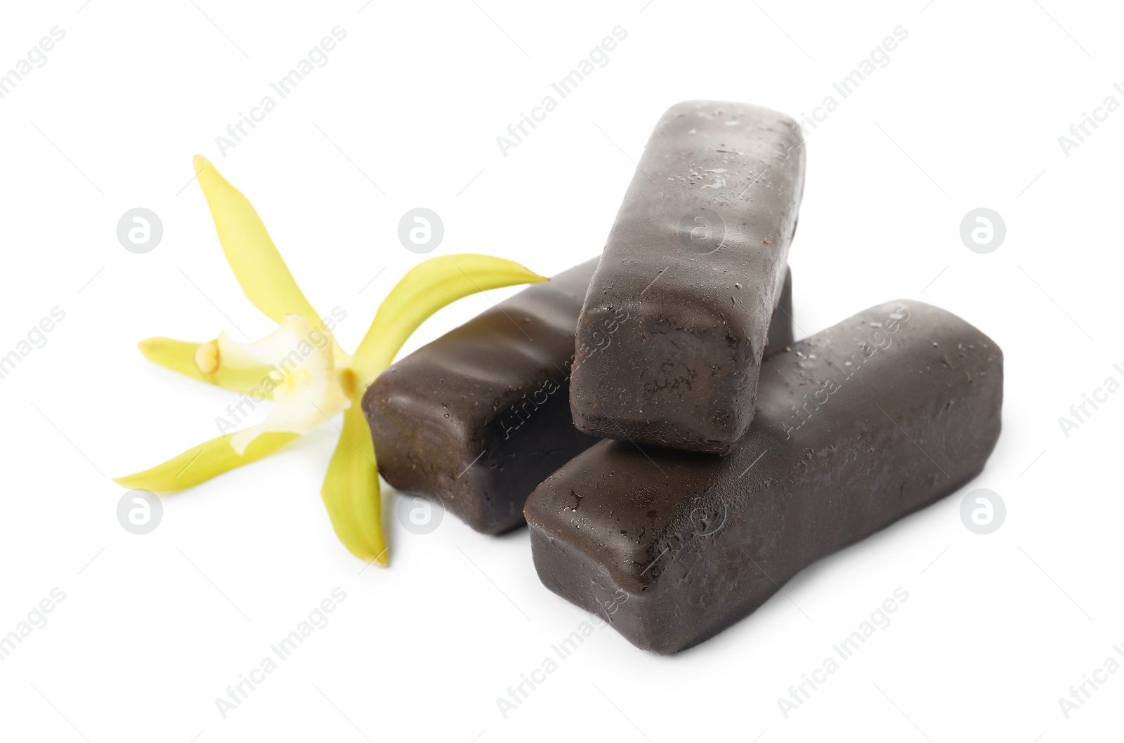 Photo of Glazed curd cheese bars and vanilla flower isolated on white