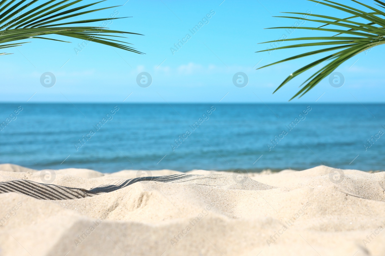 Photo of Sandy beach near sea on sunny day