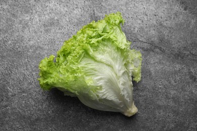 Photo of Fresh lettuce on stone table, top view