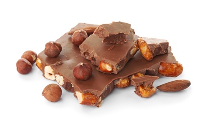Photo of Delicious milk chocolate with nuts on white background