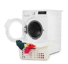 Modern washing machine and basket with laundry on white background