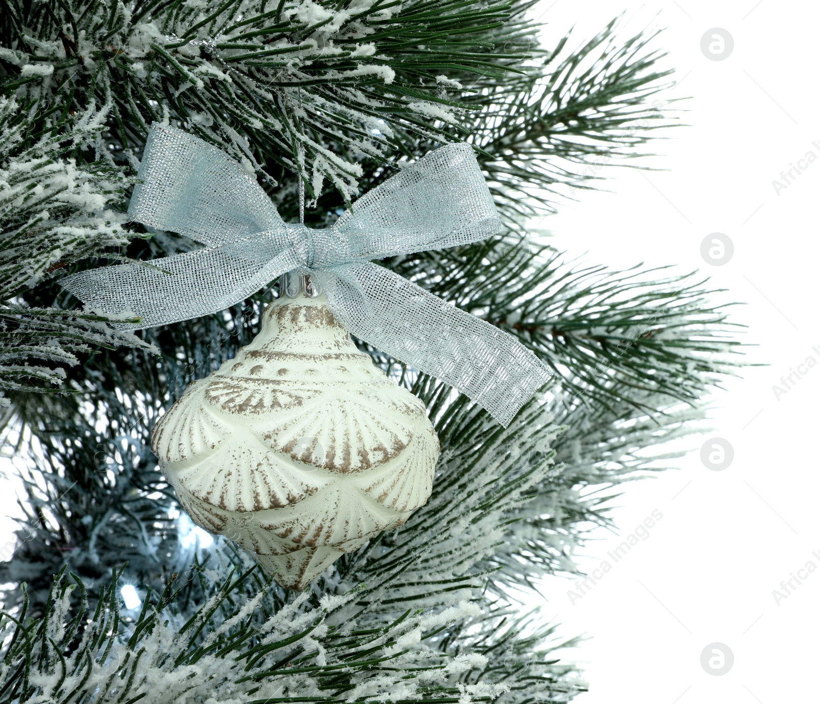 Photo of Decorated Christmas tree on white background, closeup