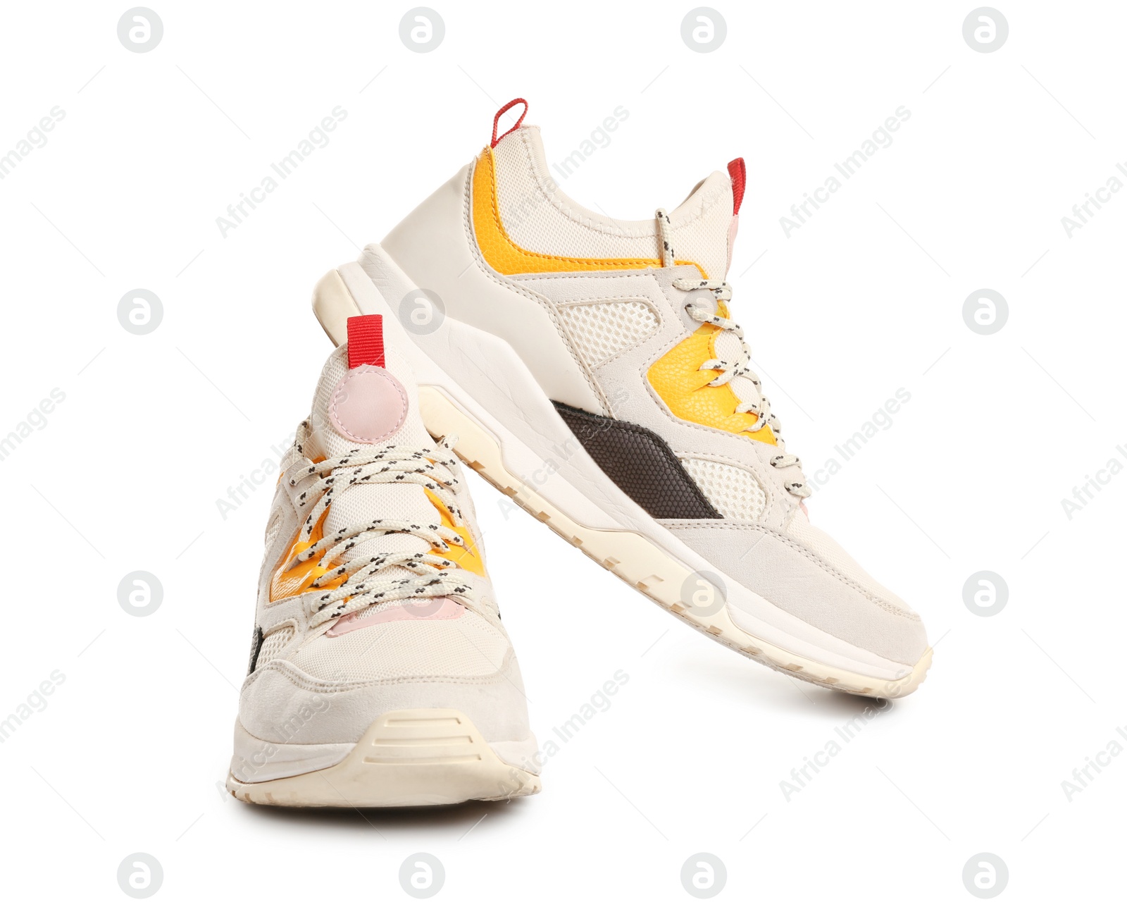 Photo of Pair of sports shoes on white background