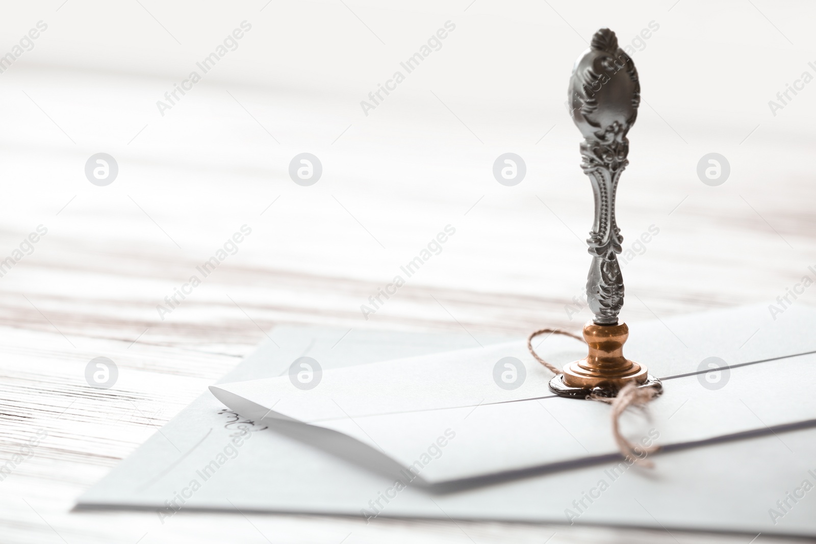 Photo of Vintage notary stamp and documents on wooden table, closeup. Space for text