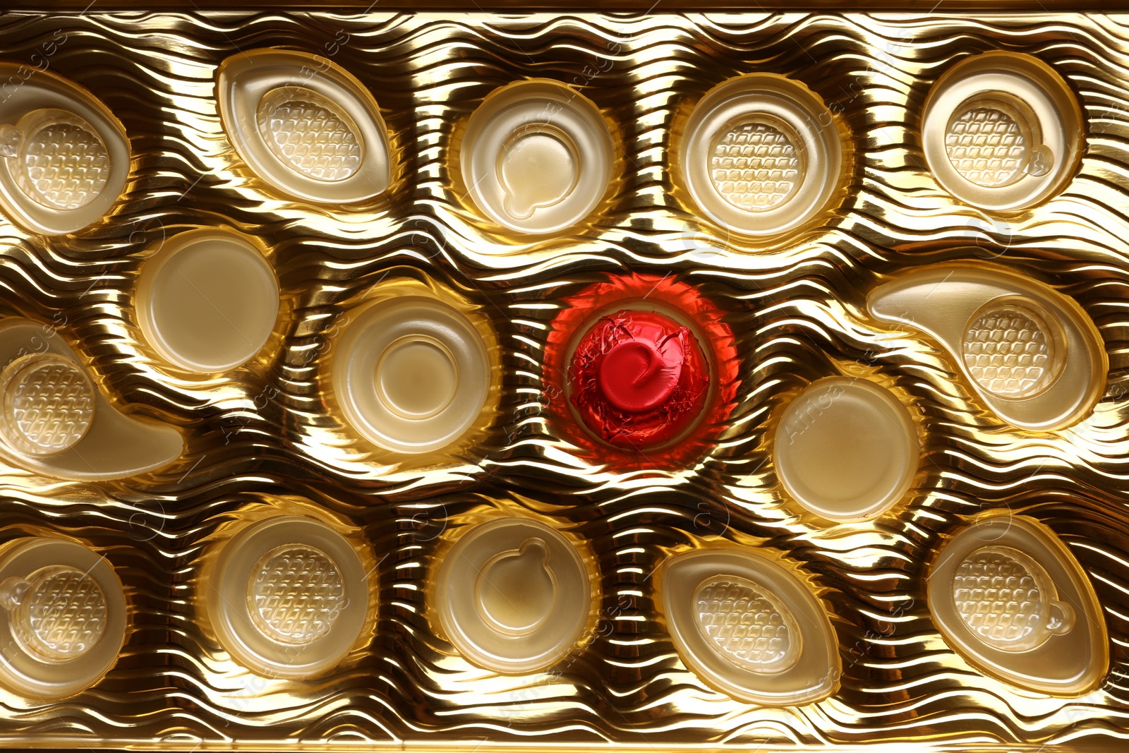 Photo of Partially empty box of chocolate candies as background, top view