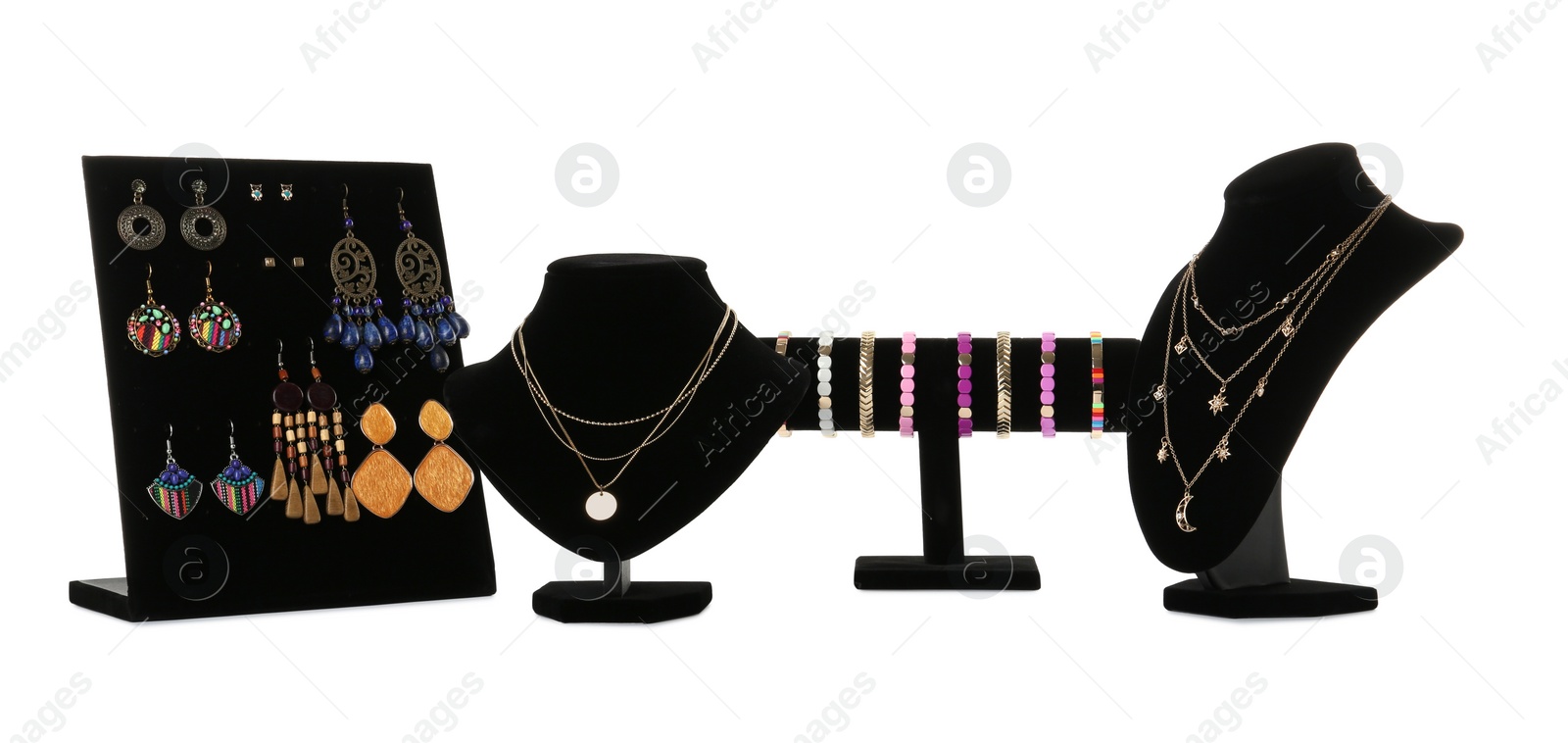 Photo of Different display stands with stylish jewelry on white background