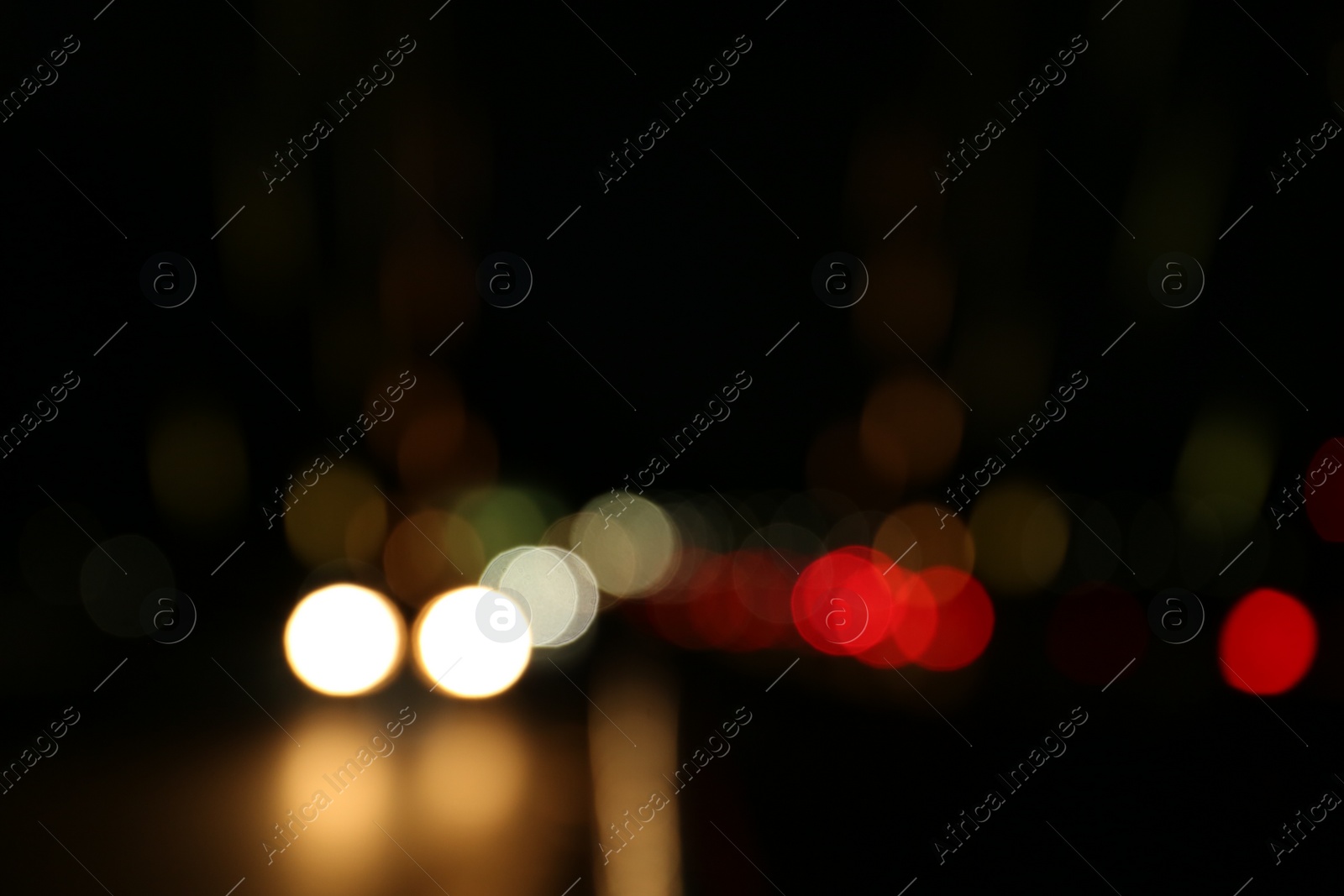 Photo of Blurred view of city lights at night. Bokeh effect