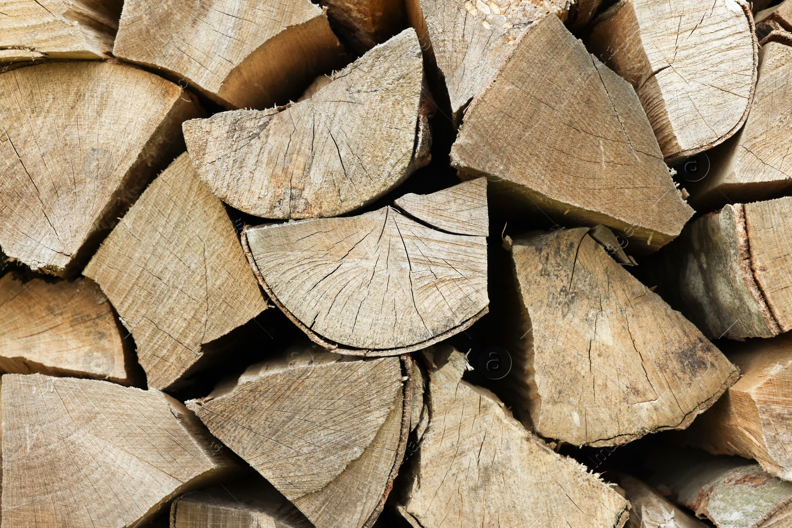 Photo of Pile of chopped firewood as background, closeup