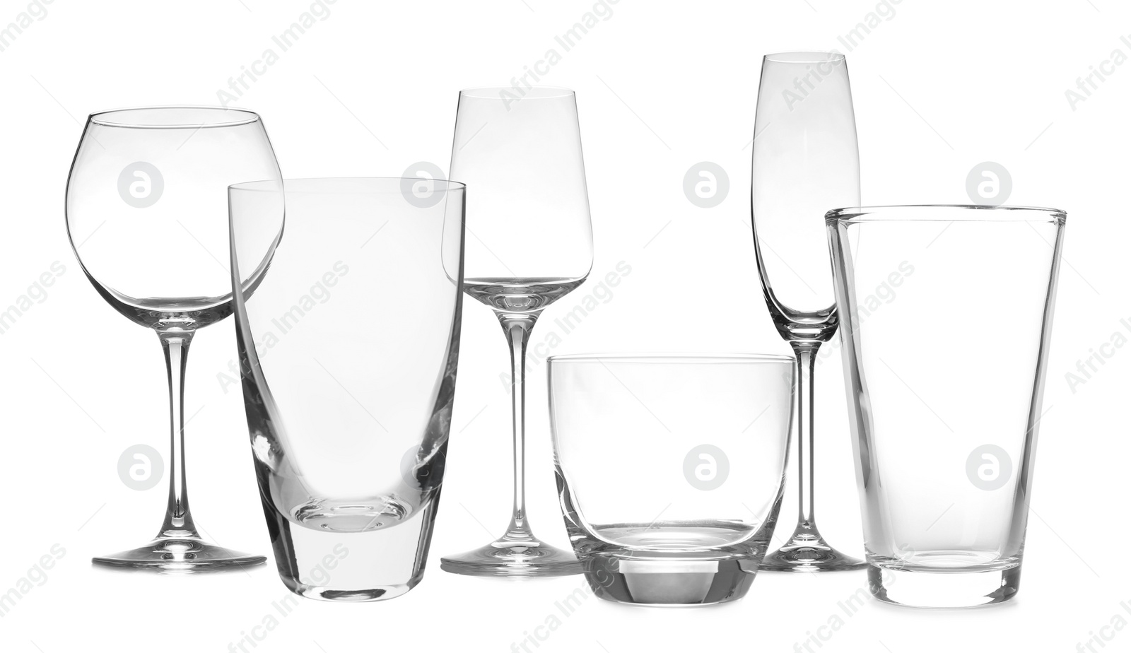 Image of Set of empty glasses on white background