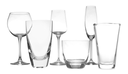 Image of Set of empty glasses on white background