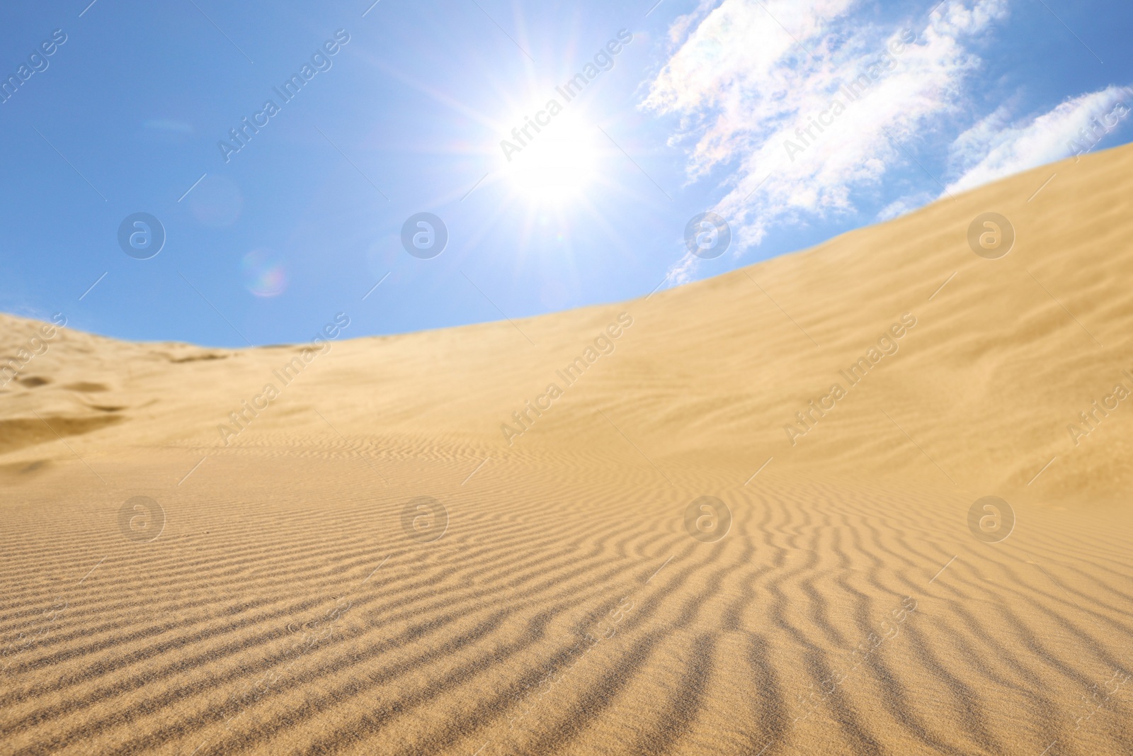 Image of Picturesque view of sandy desert and blue sky on hot sunny day 