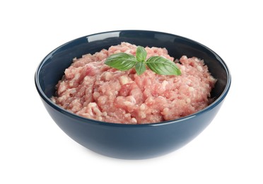 Raw chicken minced meat with basil in bowl on white background