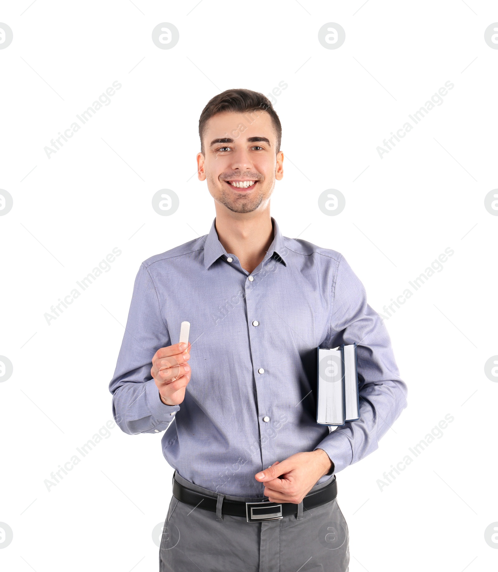 Photo of Young male teacher with books and chalk on white background