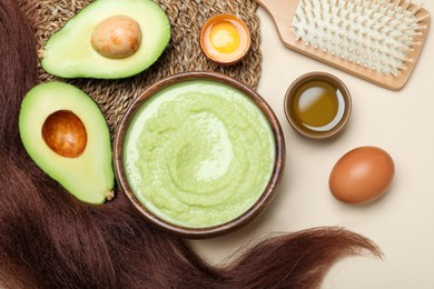 Flat lay composition with homemade hair mask and ingredients on beige background