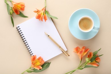 Guest list. Notebook, pen, coffee and beautiful flowers on beige table, flat lay. Space for text