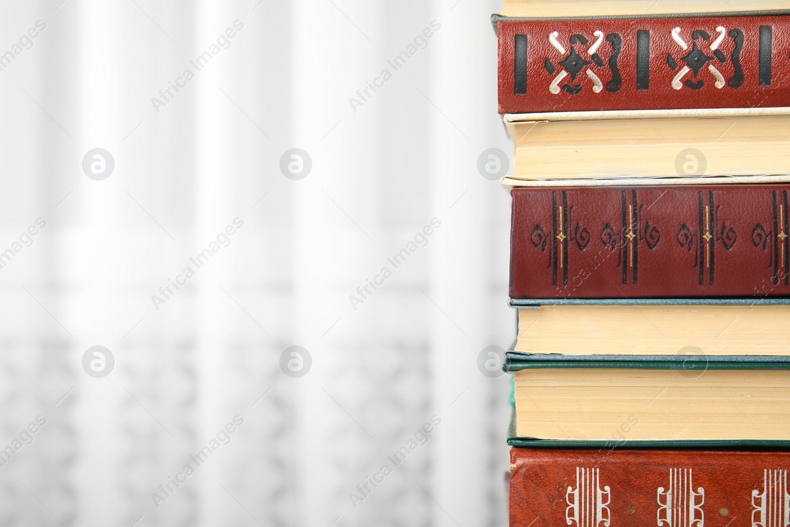 Photo of Collection of different books indoors, closeup. Space for text