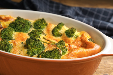Photo of Tasty broccoli casserole in baking dish, closeup