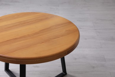 Empty wooden table indoors, closeup. Stylish furniture