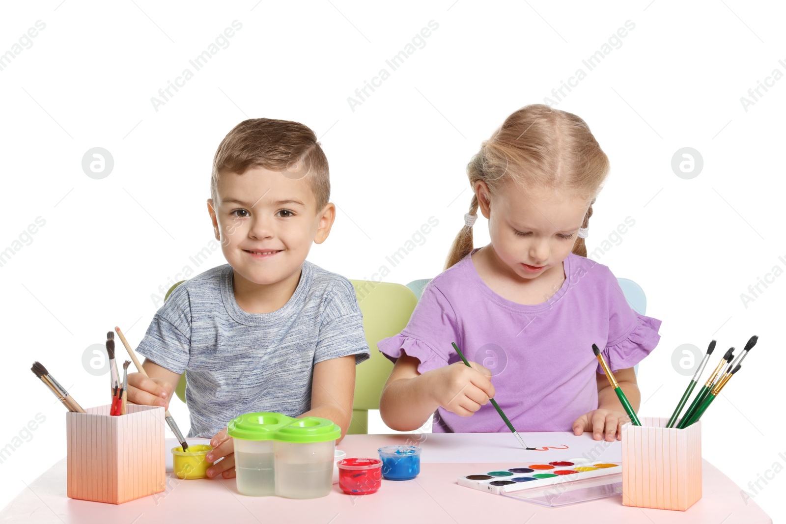 Photo of Cute children painting picture at table on white background