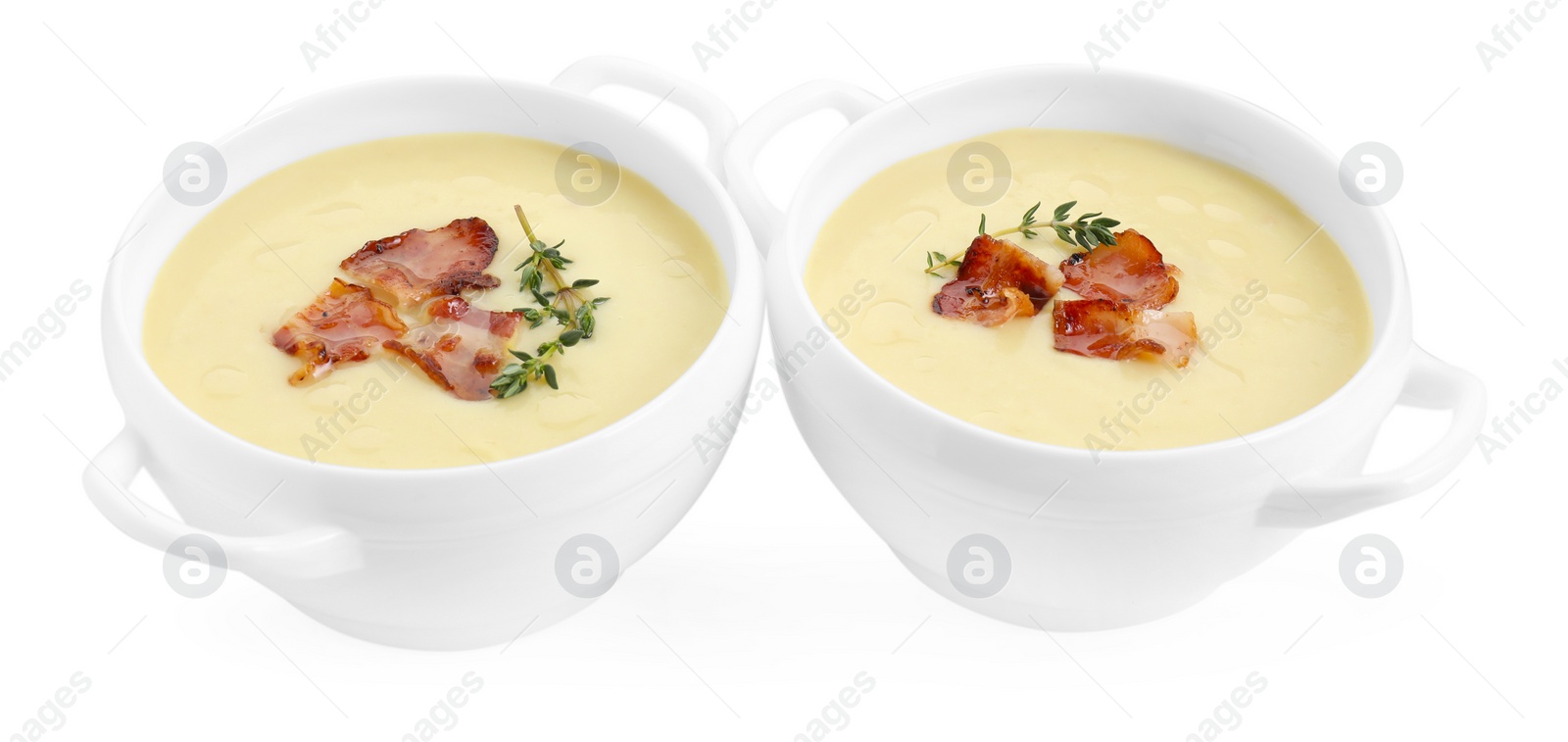 Photo of Tasty potato soup with bacon and rosemary in bowls isolated on white