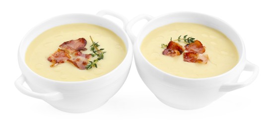 Photo of Tasty potato soup with bacon and rosemary in bowls isolated on white