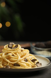 Tasty fettuccine with truffle on table, closeup