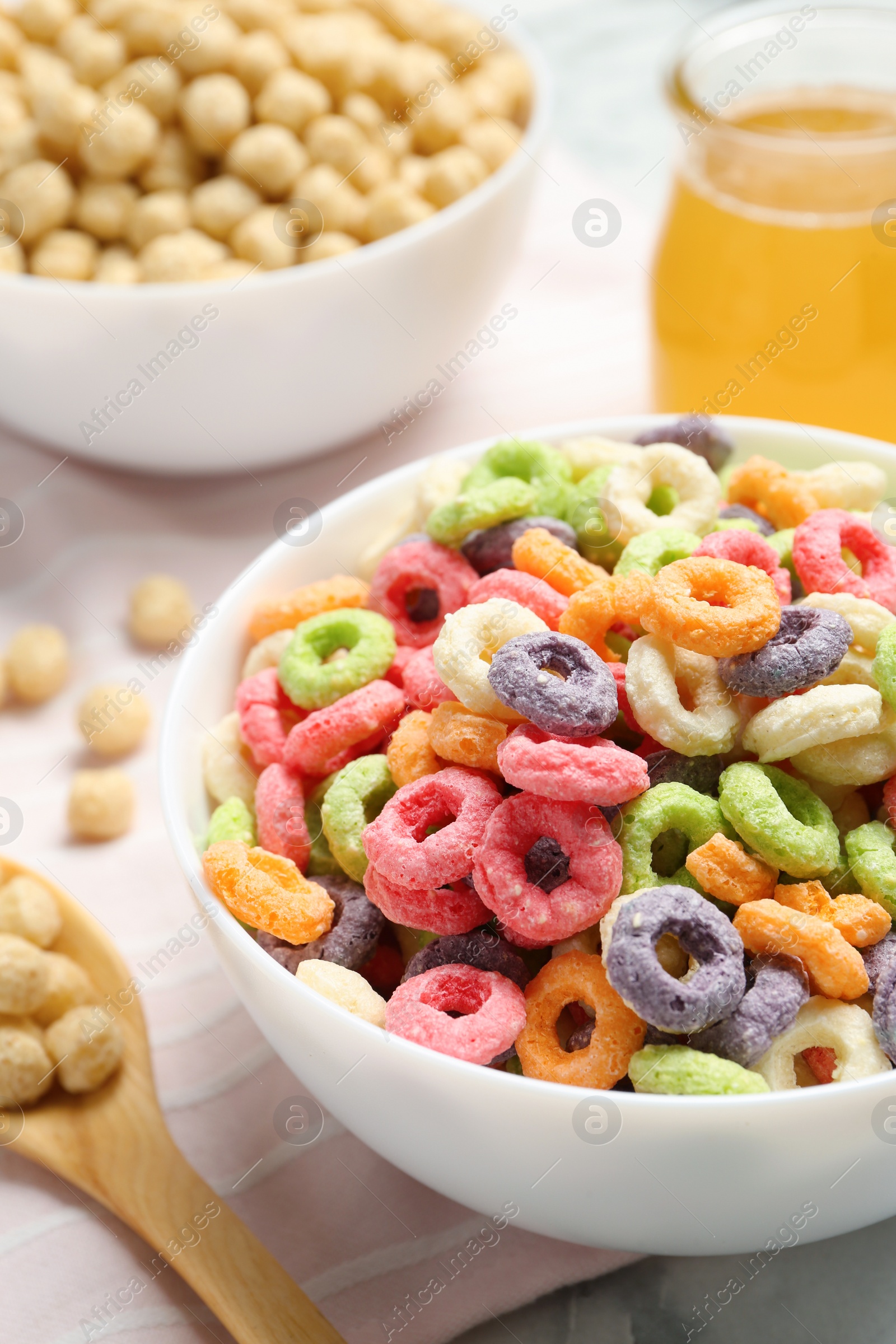 Photo of Different breakfast cereals on fabric, closeup view