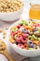 Different breakfast cereals on fabric, closeup view