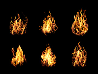 Collection of bright fire flames on black background