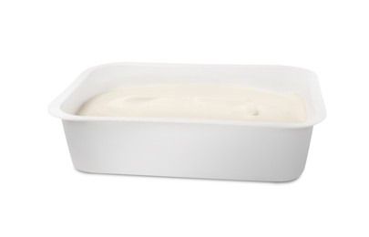 Plastic container of tasty cream cheese isolated on white