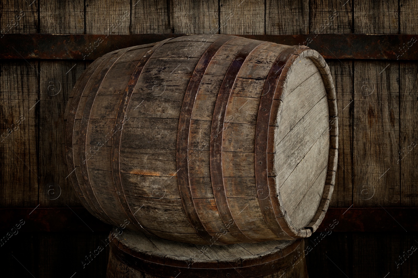 Image of Two wooden barrels near old textured wall