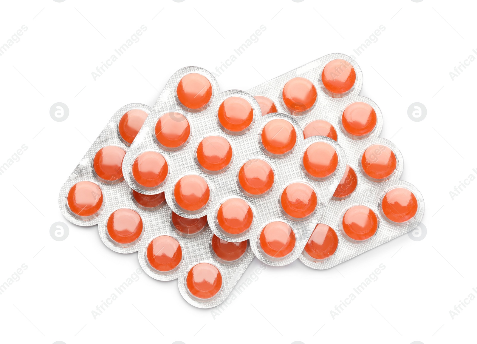 Photo of Blisters with orange cough drops on white background, top view