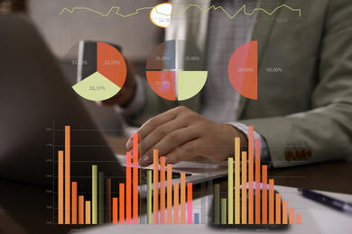 Finance trading concept. Man working with laptop in office and charts, closeup