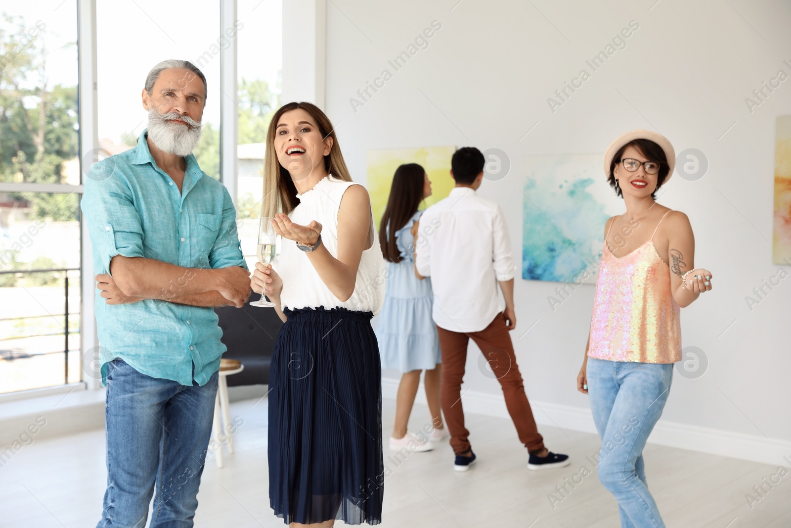 Photo of Group of people at exhibition in art gallery