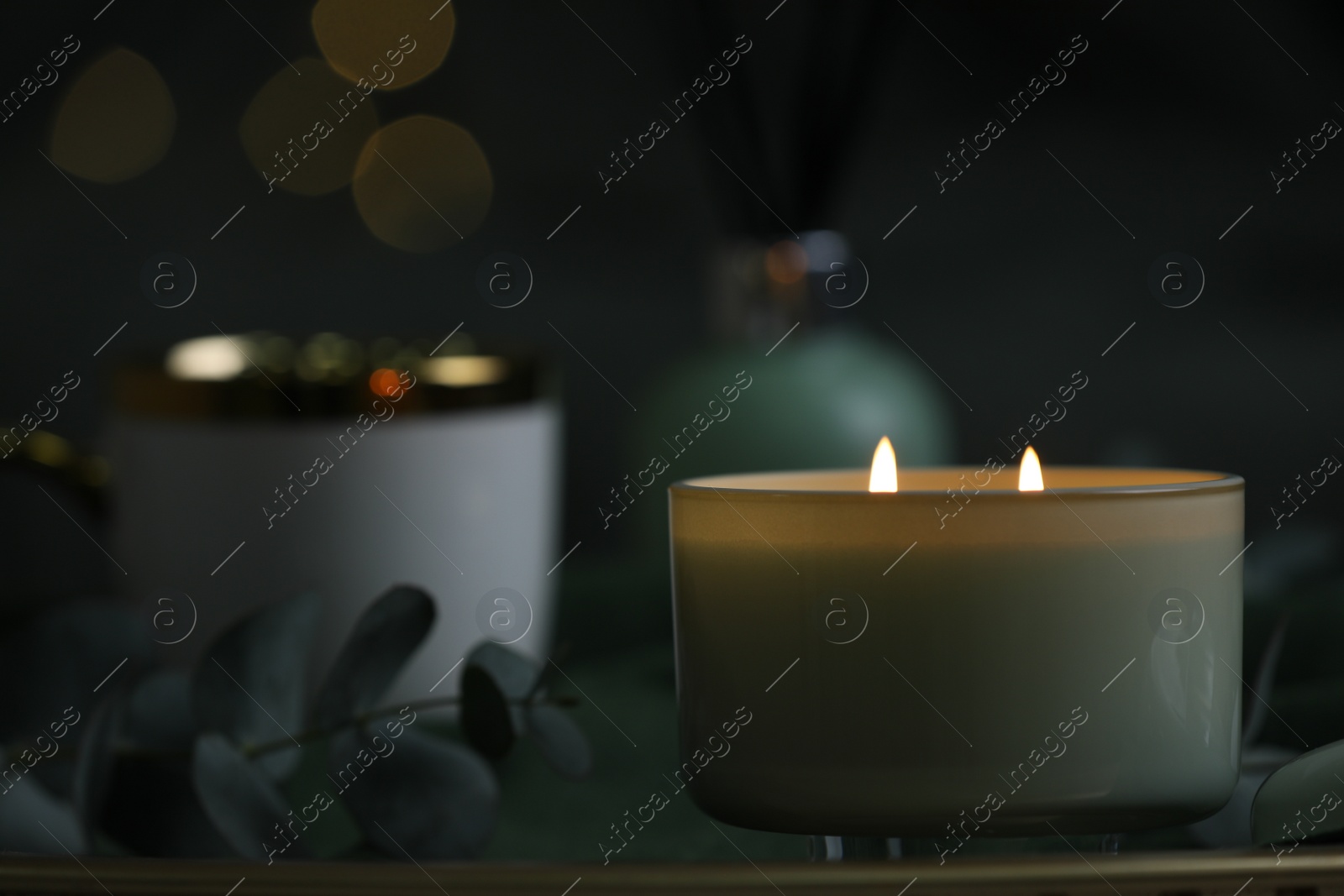 Photo of Beautiful burning candle on table, closeup. Space for text