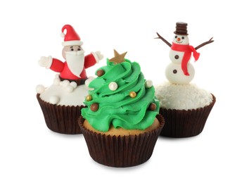 Photo of Different beautiful Christmas cupcakes on white background