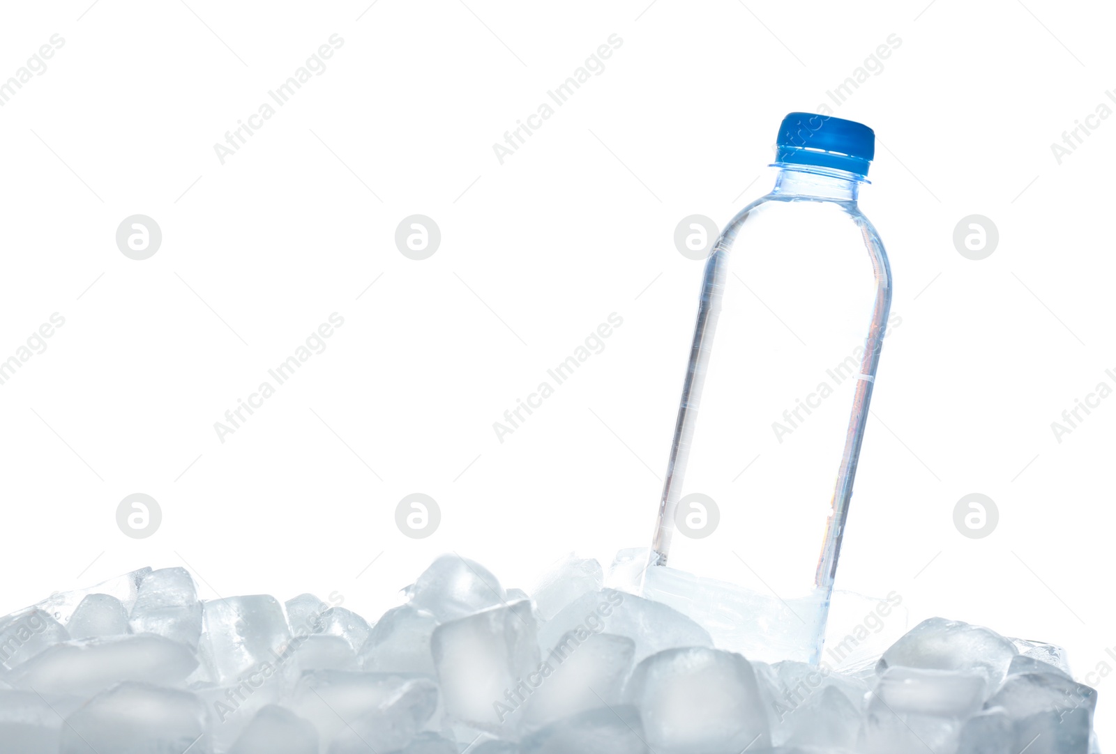 Photo of Bottle of water on ice cubes against white background