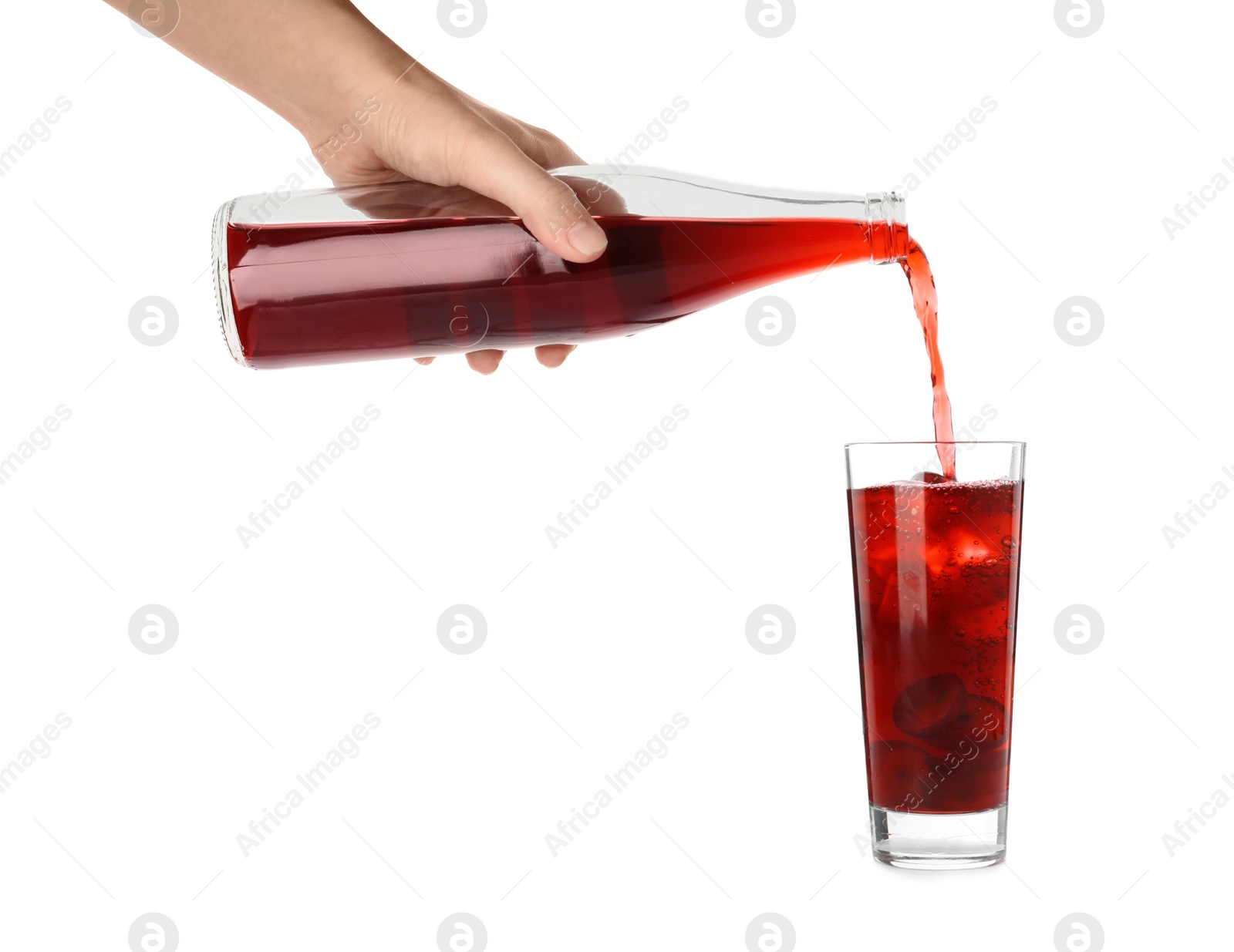 Photo of Woman pouring grape soda water into glass on white background, closeup. Refreshing drink