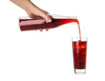 Photo of Woman pouring grape soda water into glass on white background, closeup. Refreshing drink