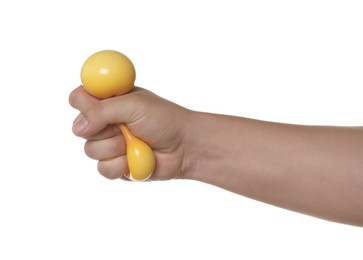 Man squeezing yellow stress ball on white background, closeup