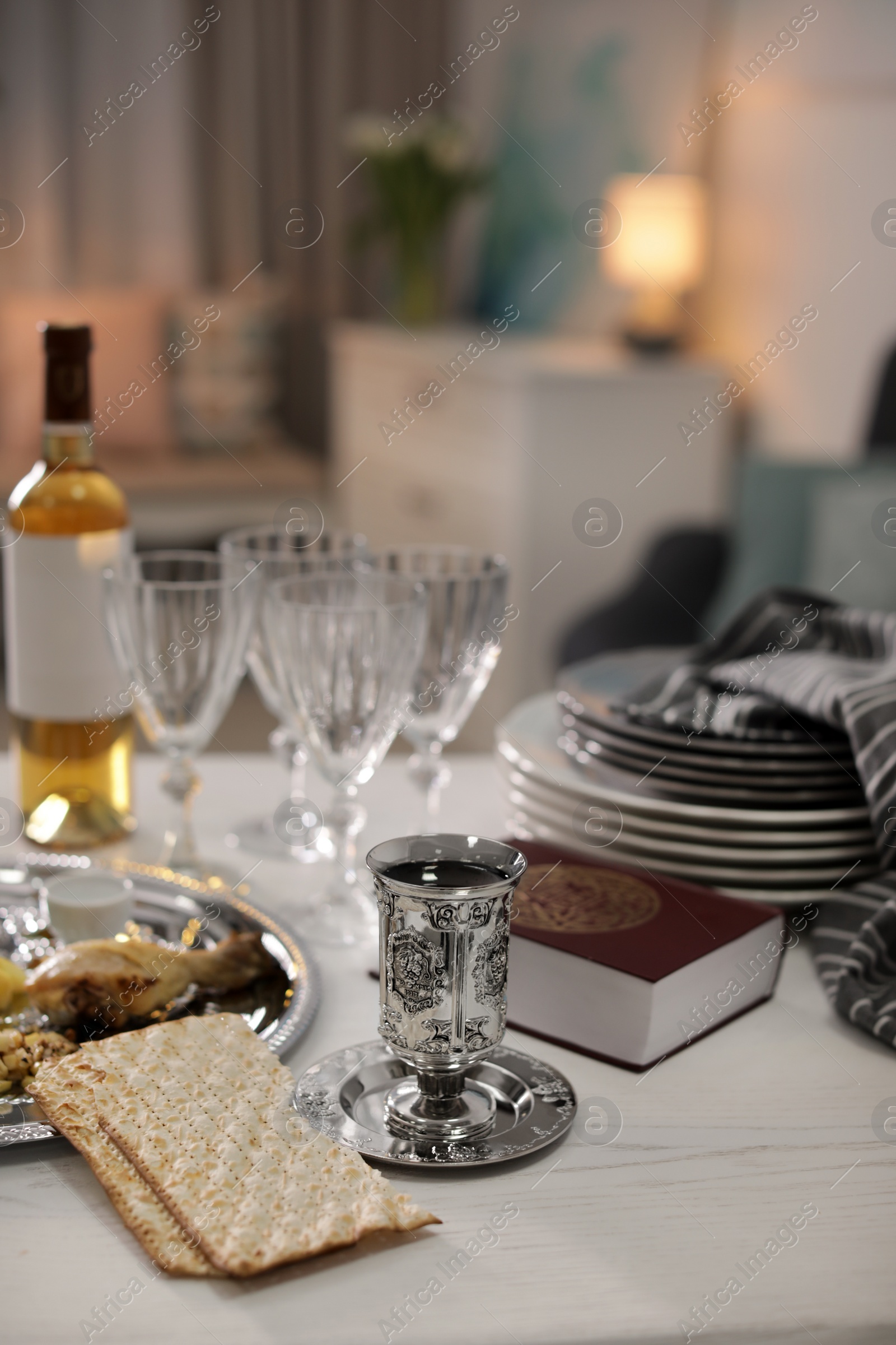 Photo of Table served for Passover (Pesach) Seder indoors, space for text