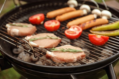Barbecue grill with tasty fresh food, closeup