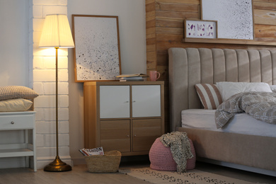 Photo of Modern cabinet in beautiful bedroom. Interior design
