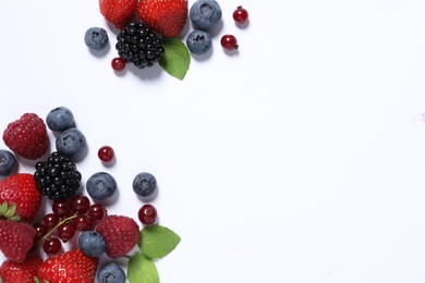 Photo of Many different fresh berries and mint leaves on white background, flat lay. Space for text