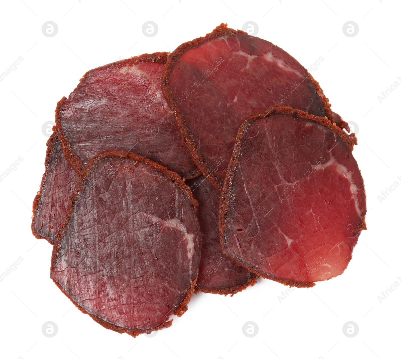 Photo of Delicious dry-cured beef basturma slices on white background, top view