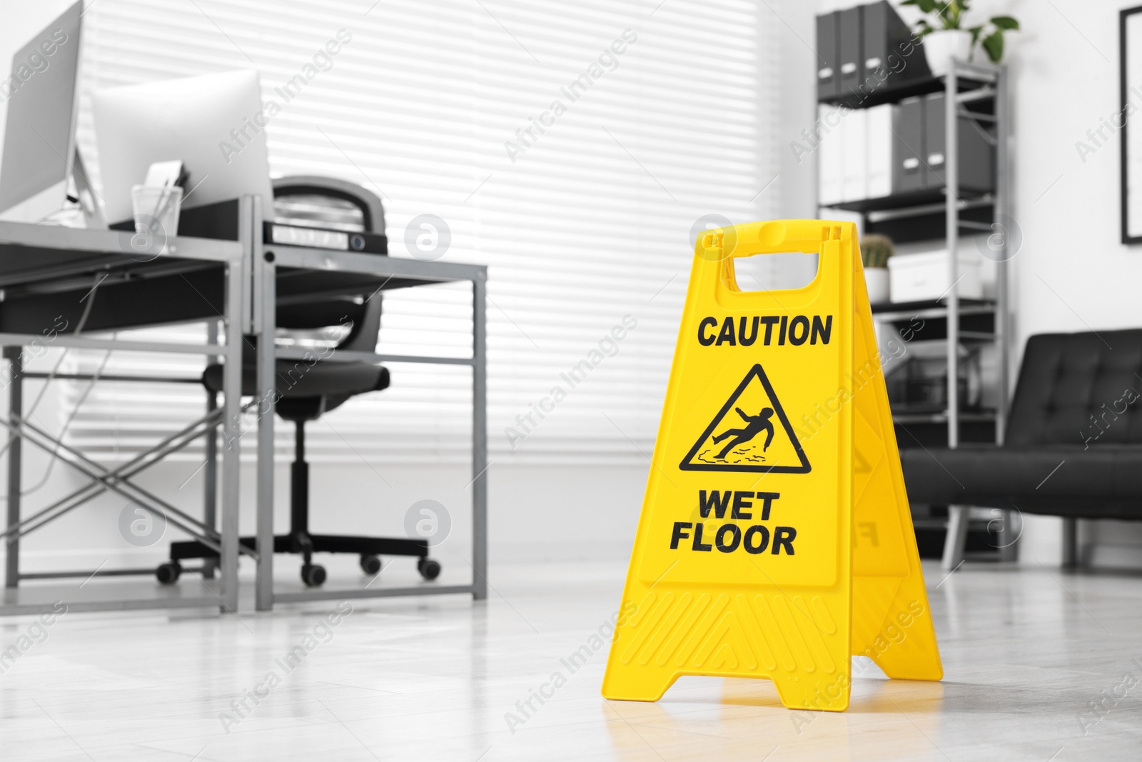 Photo of Cleaning service. Wet floor sign in office, space for text