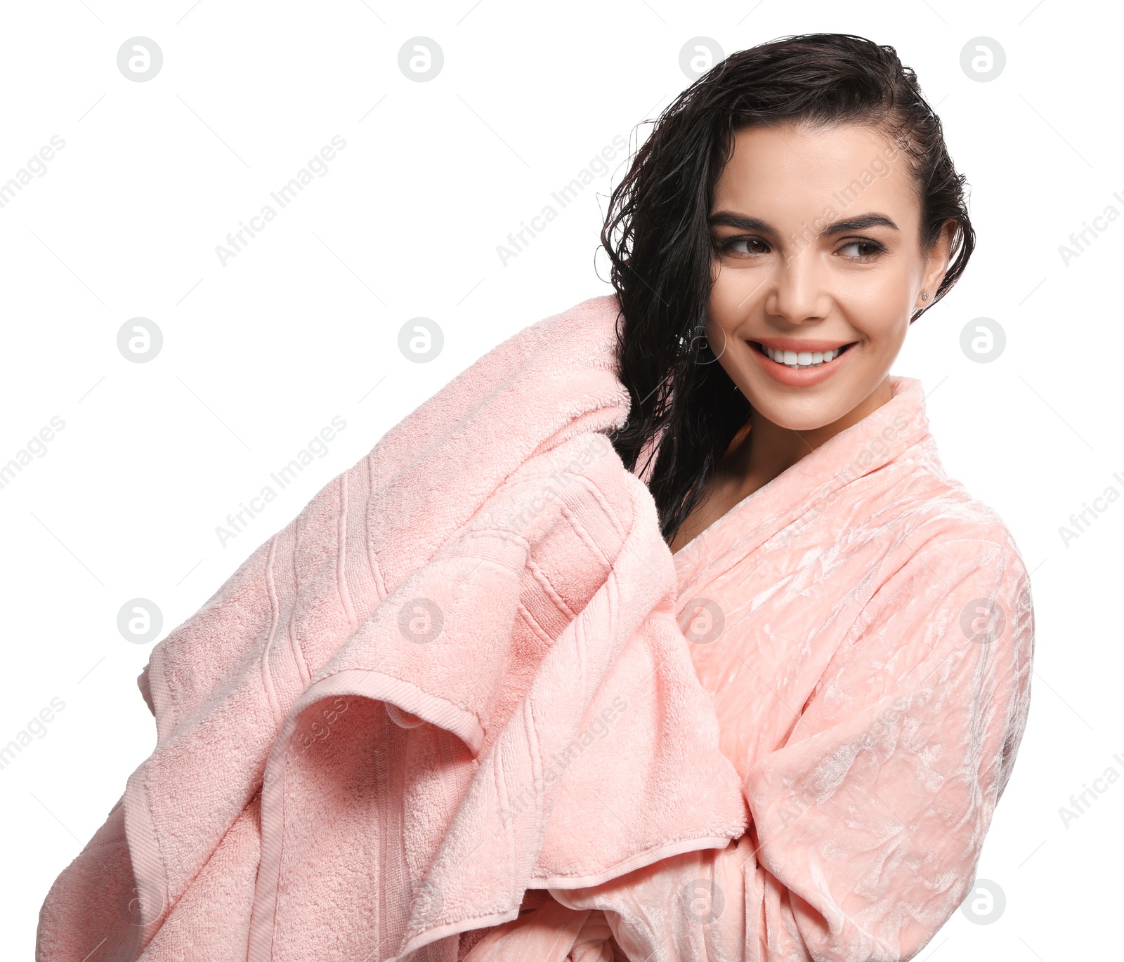 Photo of Happy young woman drying hair with towel after washing on white background